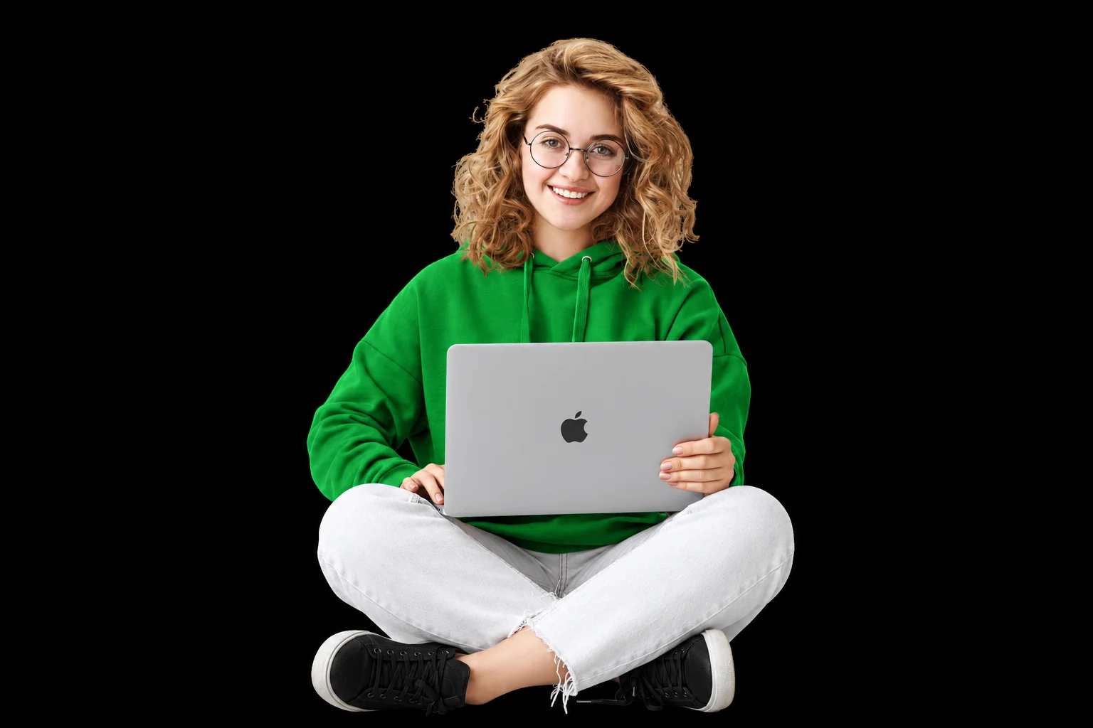 Write for us: a writer in a green hoodie working on a laptop